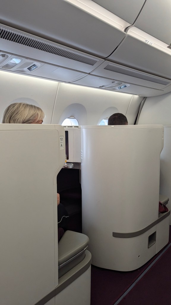Interior view of Thai Airways Boeing 787-9 business class cabin, showcasing the privacy partitions and seating arrangement.