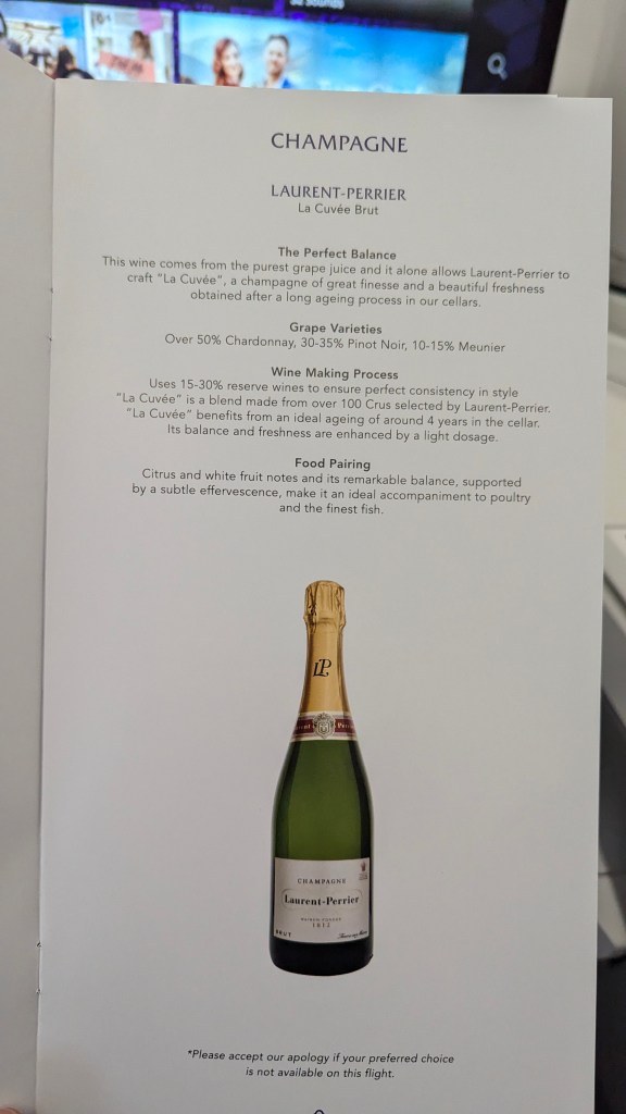 Champagne menu showing Laurent-Perrier La Cuvée Brut with a bottle image and details about its characteristics, grape varieties, wine making process, and food pairing suggestions.